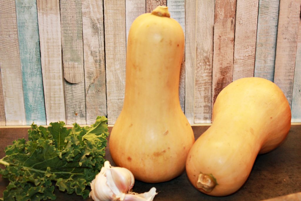 whole butternut squash, kale, and garlic