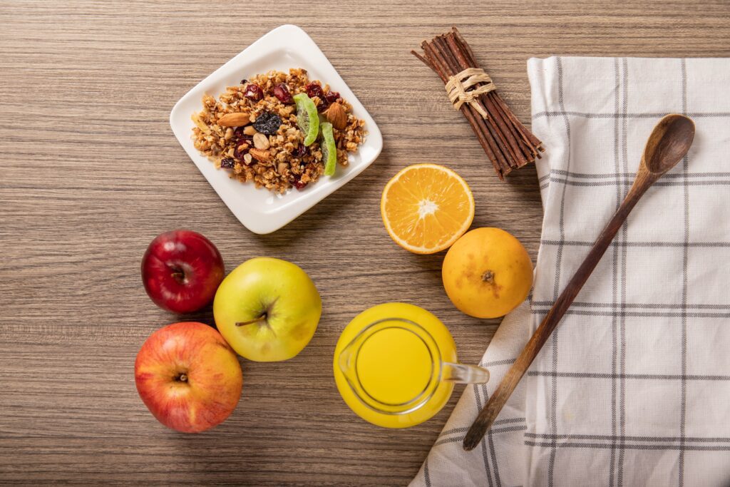 Granola, apples, and orange