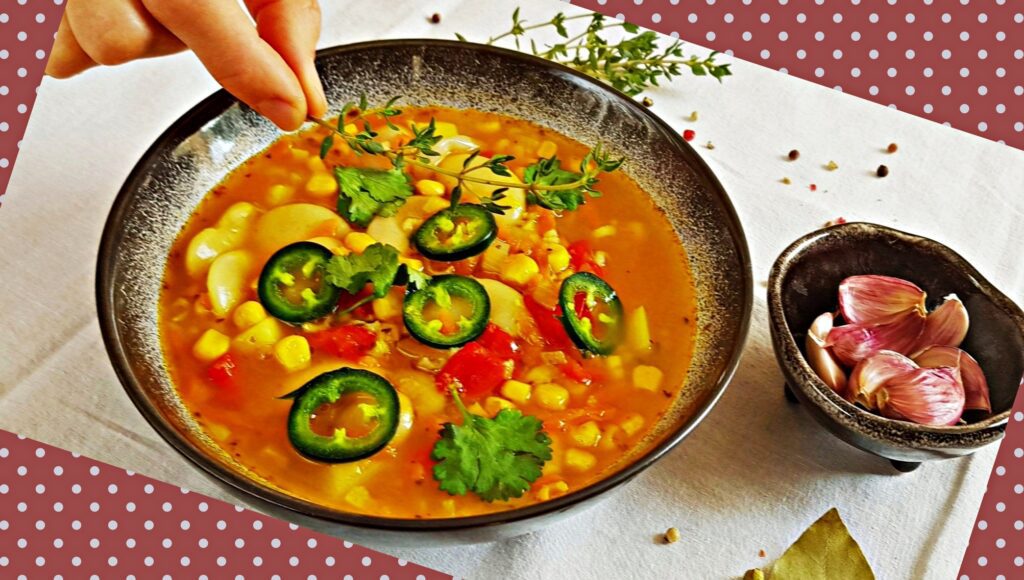 bowl of lima bean soup with sweet corn and fresh herbs