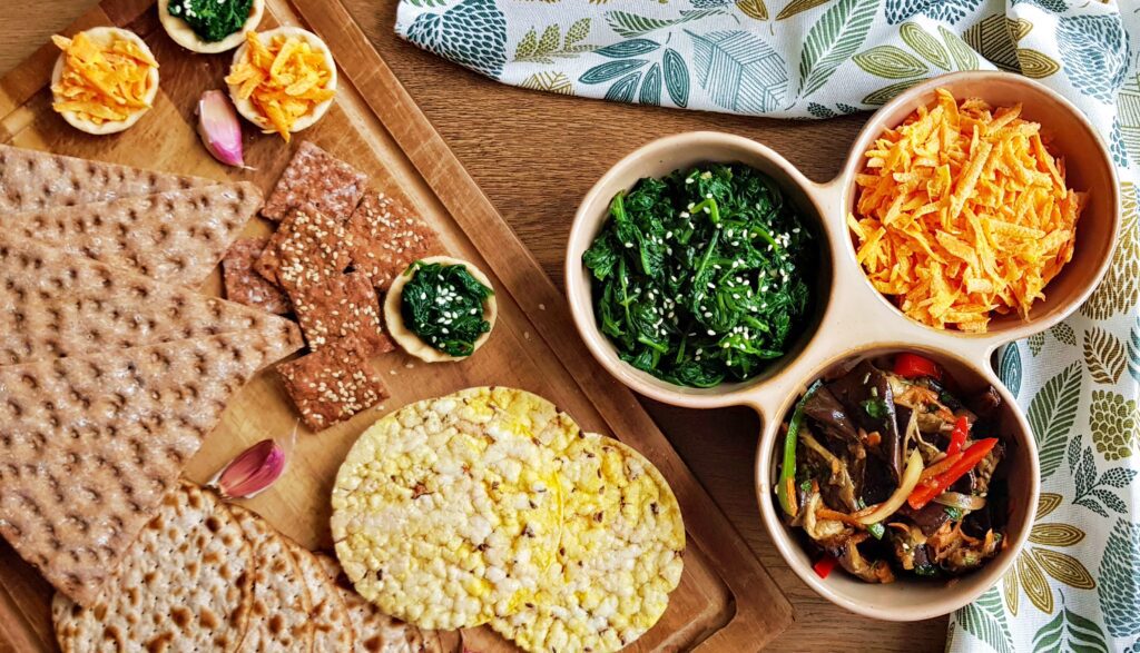 three cold appetizers: garlicky carrot salad, sesame spinach, and marinated eggplant. And some crackers. 