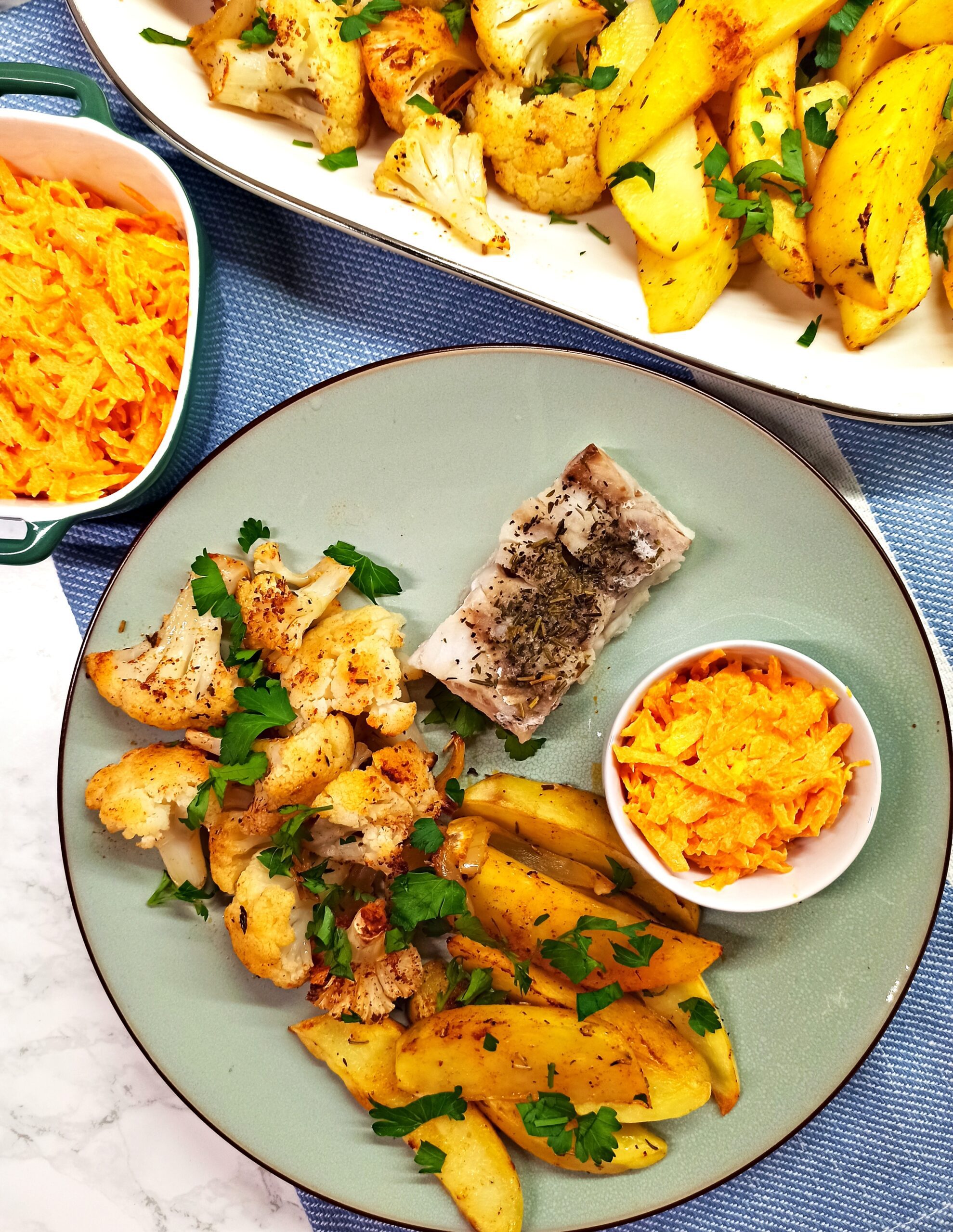 roasted potatoes with cauliflower, white fish and carrot salad