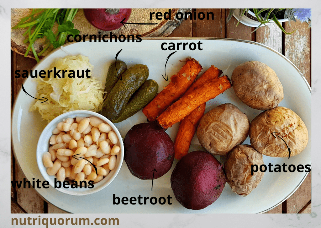  cooked root vegetables, such as beetroots, potatoes, carrots, white beans, sauerkraut, and red onion