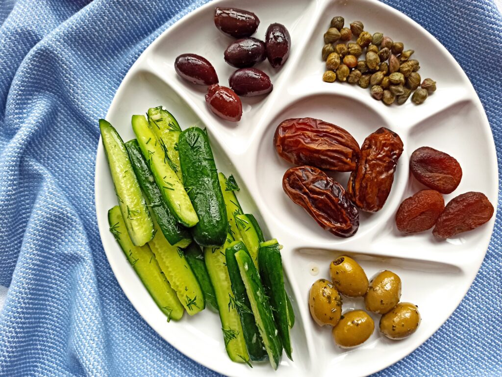 marinated cucumbers, olives, capers, dates