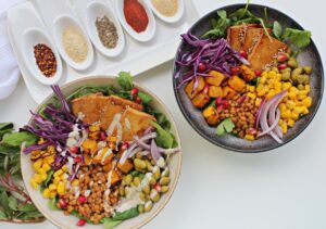 plant power bowl: tofu, edamame, sweet corn, red onion, purple cabbage, pumpkin, lentils, tahini