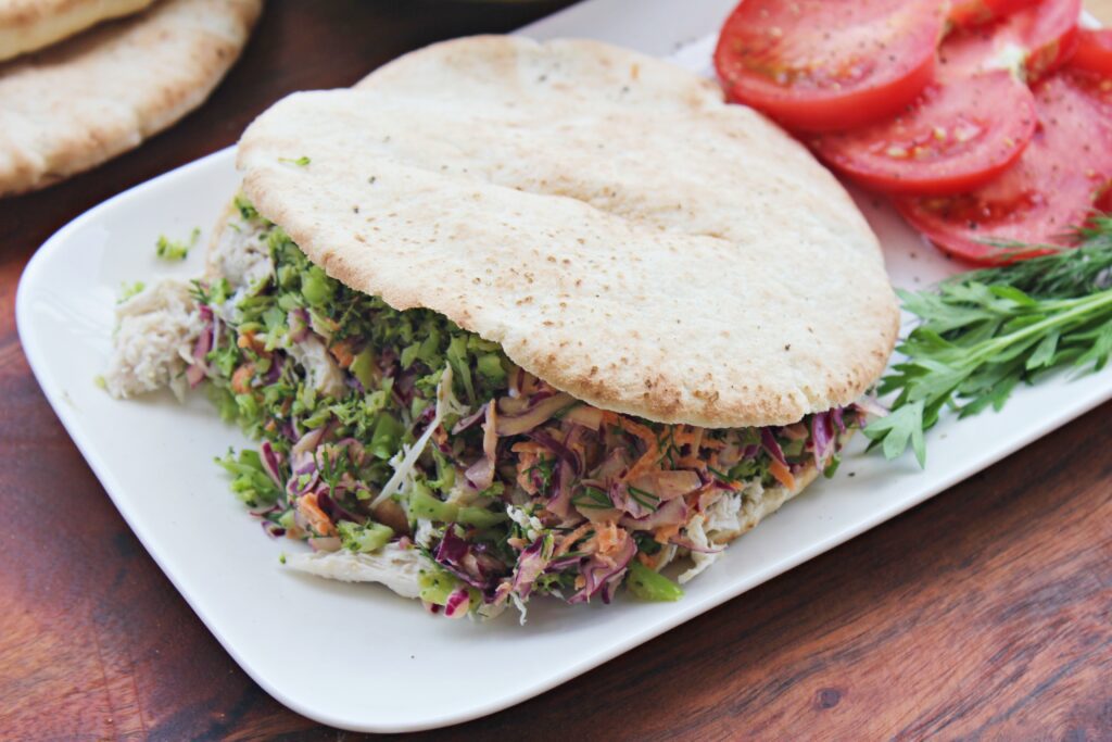 pitta bread with chicken and coleslaw