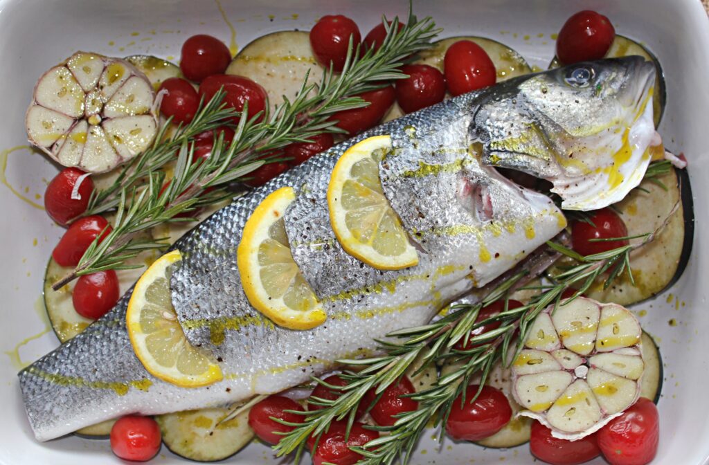 One-Pan Baked Sea Bass with garlic, eggplant and cherry tomatoes