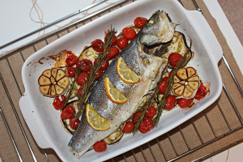 One-Pan Baked Sea Bass with garlic, eggplant and cherry tomatoes