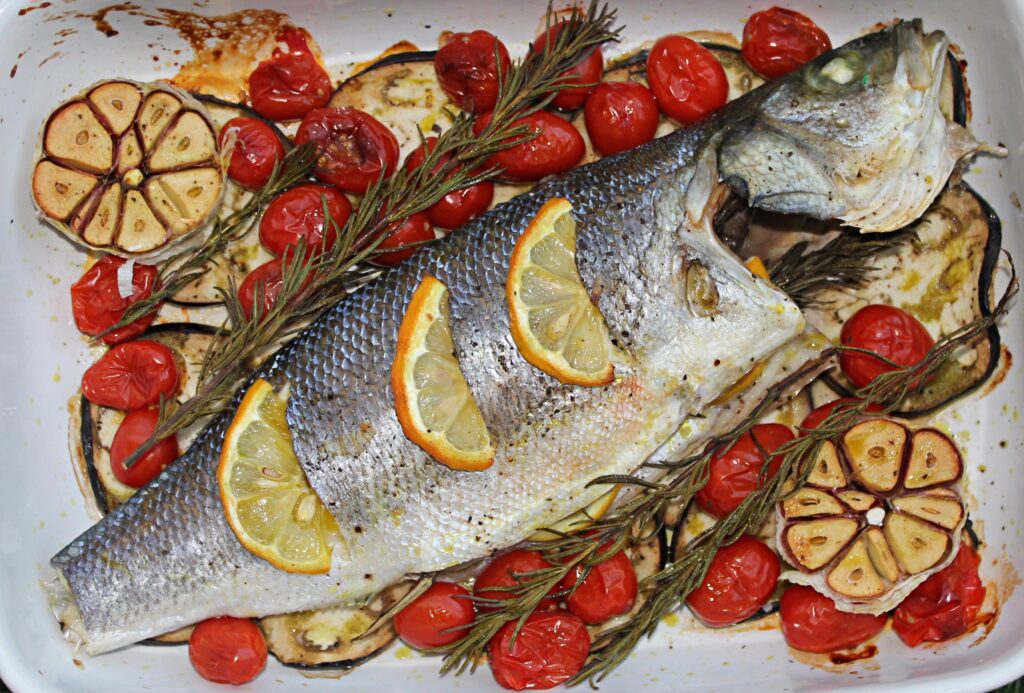 One-Pan Baked Sea Bass with garlic, eggplant and cherry tomatoes