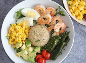 quinoa bowl with prawns, avocado and egg