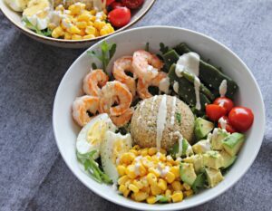 quinoa bowl with prawns, avocado and egg