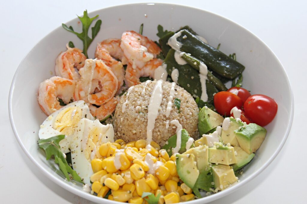 quinoa bowl with prawns, avocado and egg