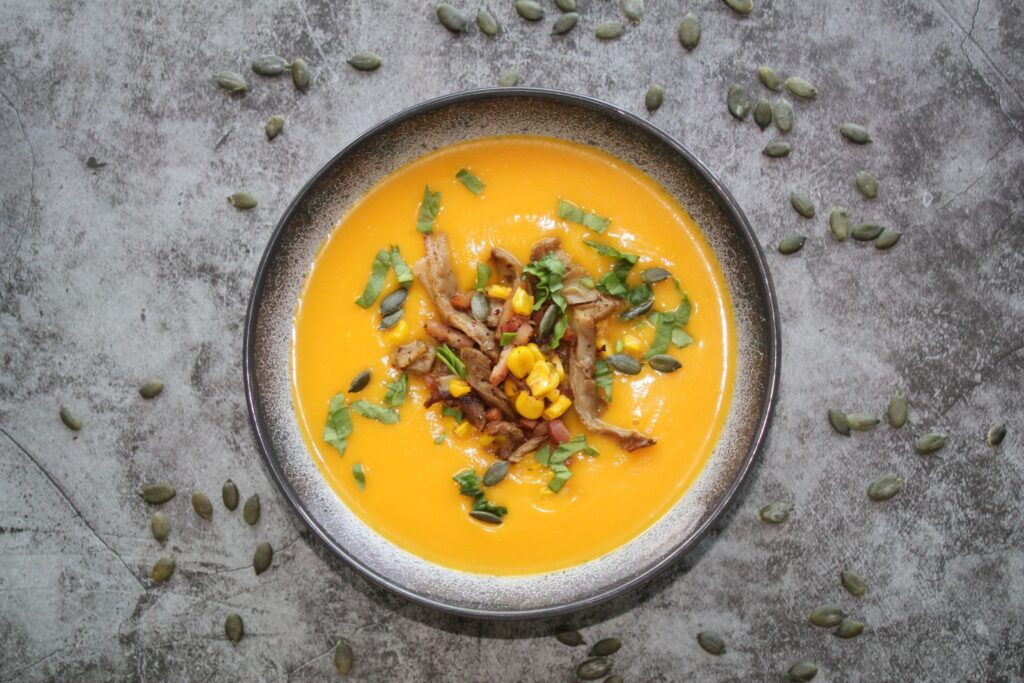 pumpkin soup with wild mushrooms and crispy bacon