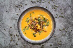 pumpkin soup with wild mushrooms and crispy bacon