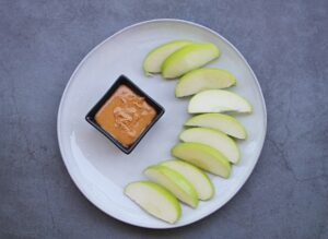 green apple with nut butter