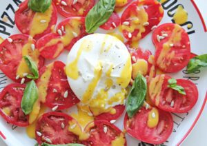 tomato salad with creamy burrata and peach dressing